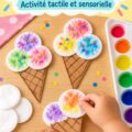 Un enfant s'amusant à créer une glace en coton colorée avec des matériaux de bricolage.